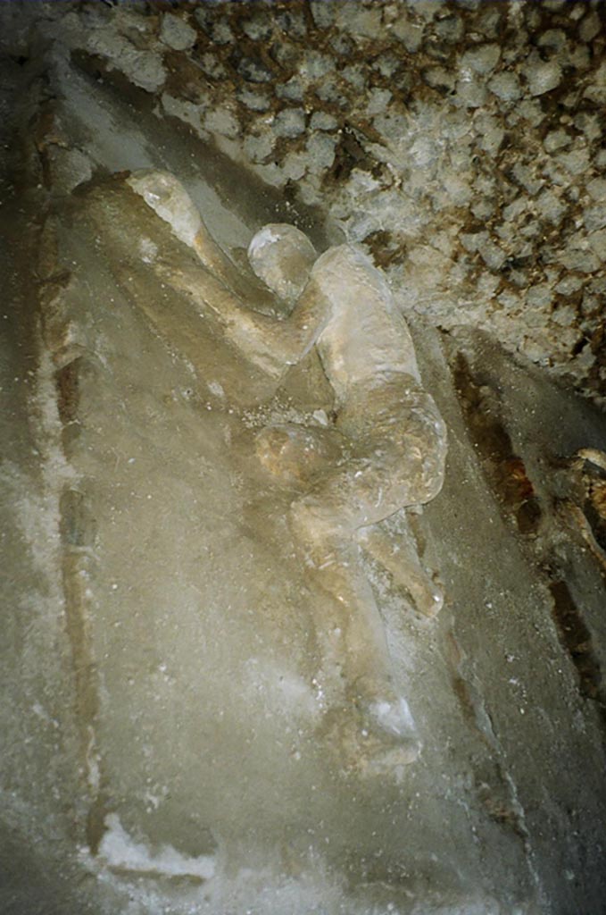 Pompeii, outside Porta Nocera. July 2010. 
Plaster cast of a third fleeing victim 32 found on 16th March 1957. Photo courtesy of Rick Bauer.