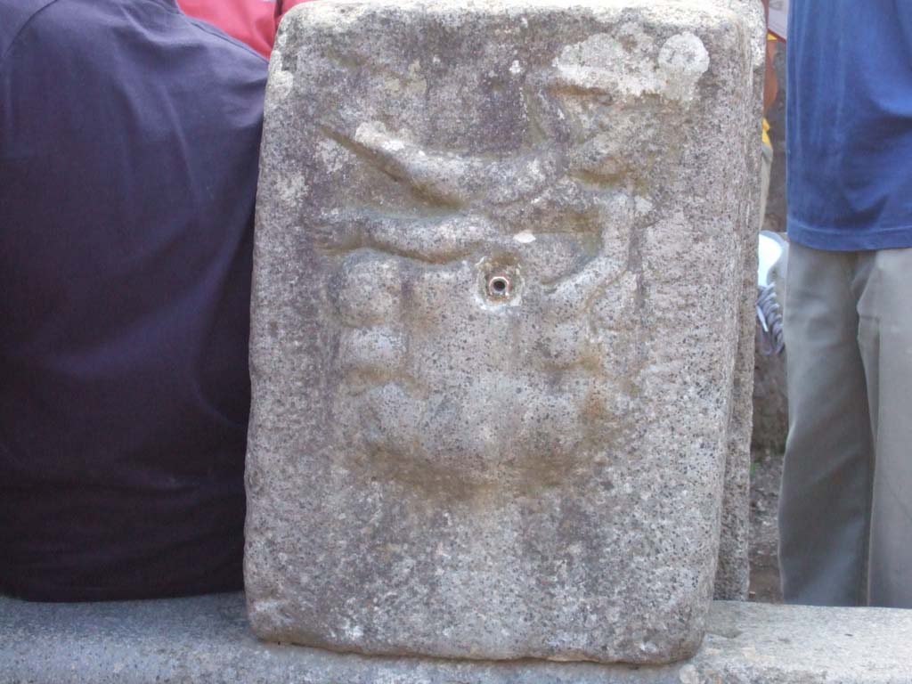 Fountain outside I.12.2 on Via dell’Abbondanza. September 2005. Relief of Satyr on rock-fountain or water source.
See Eschebach, H., 1983. Pompeii, Herculaneum, Stabiae; Bollettino dell’Associazione Internazionale Amici di Pompei 1, p. 12.