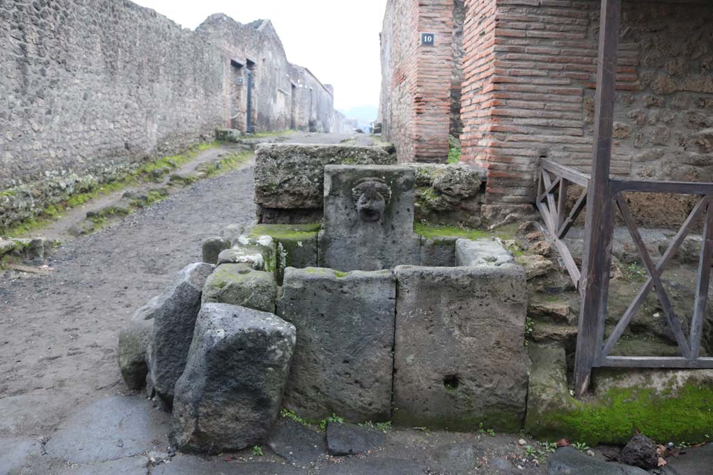 Fountain at 1.13.10, Pompeii. December 2018. Looking west towards fountain at junction. Photo courtesy of Aude Durand.