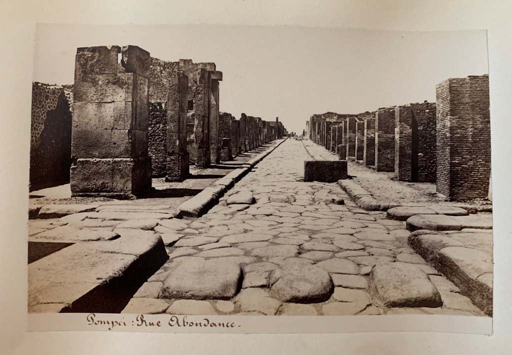 Fountain outside VII.14.13 and VII.14.14 on Via dell’Abbondanza. Album by M. Amodio, c.1880, entitled “Pompei, destroyed on 23 November 79, discovered in 1748”.
Looking west to crossroads with Via dei Teatri, on left, and Vicolo del Lupanare, on right.
Photo courtesy of Rick Bauer.