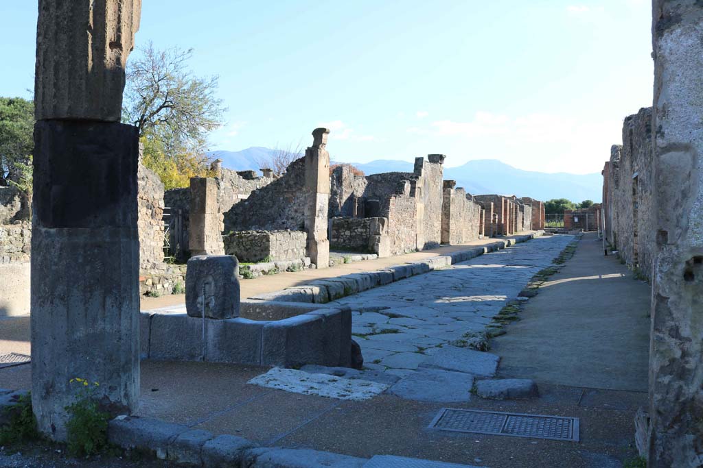 Fountain outside VIII.2.11 on Via delle Scuole, Pompeii. December 2018. 
Looking south along east side, between VIII.3, on left, and VIII.2, on right, from the Forum. Photo courtesy of Aude Durand.