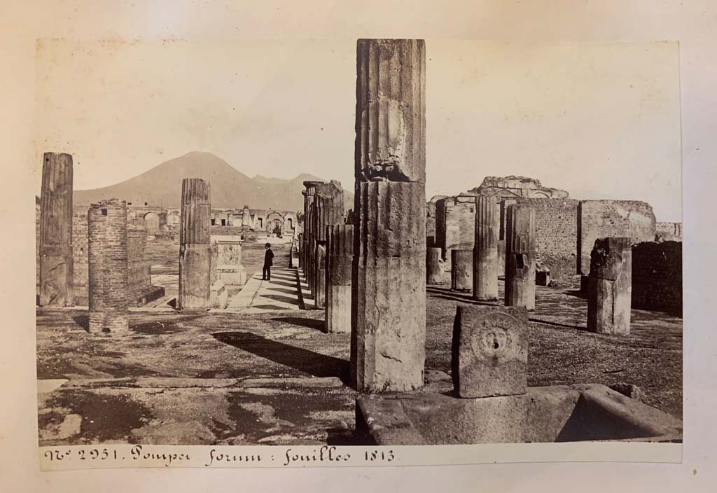 Fountain outside VIII.2.11, Pompeii. 
From an album of Michele Amodio dated 1874, entitled “Pompei, destroyed on 23 November 79, discovered in 1745”. 
Looking north towards Forum from fountain at end of Via delle Scuole. Photo courtesy of Rick Bauer.