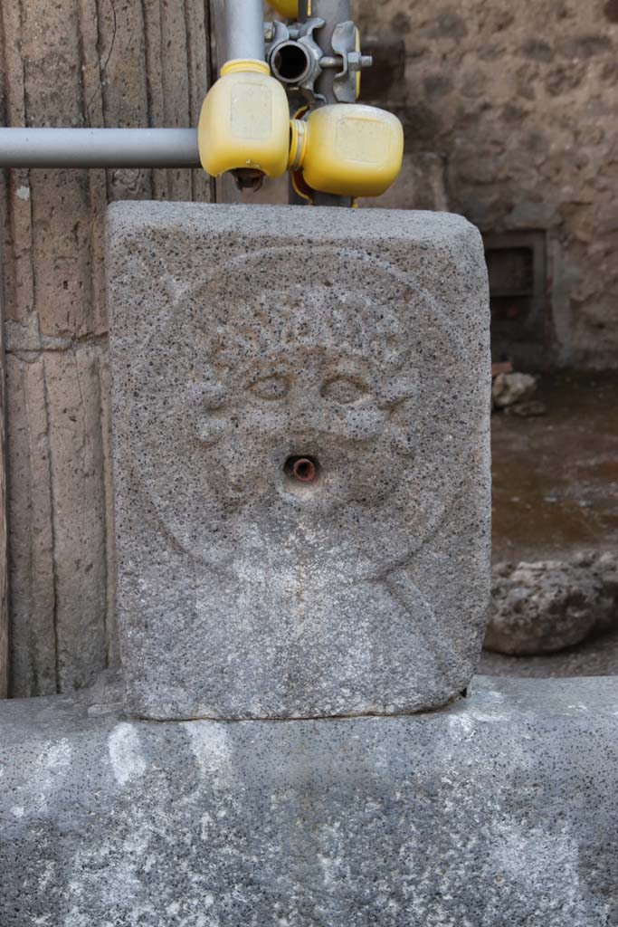 Fountain outside VIII.7.30. September 2021. 
Relief of medallion with Triton on pilaster. Photo courtesy of Klaus Heese.