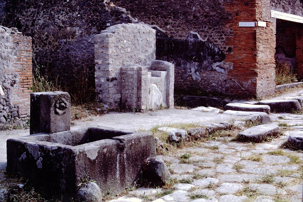 Fountain at IX.8.1, Pompeii, 1968. Looking south-west across fountain towards street shrine on Via di Nola. Photo by Stanley A. Jashemski.
Source: The Wilhelmina and Stanley A. Jashemski archive in the University of Maryland Library, Special Collections (See collection page) and made available under the Creative Commons Attribution-Non Commercial License v.4. See Licence and use details.
J68f1618