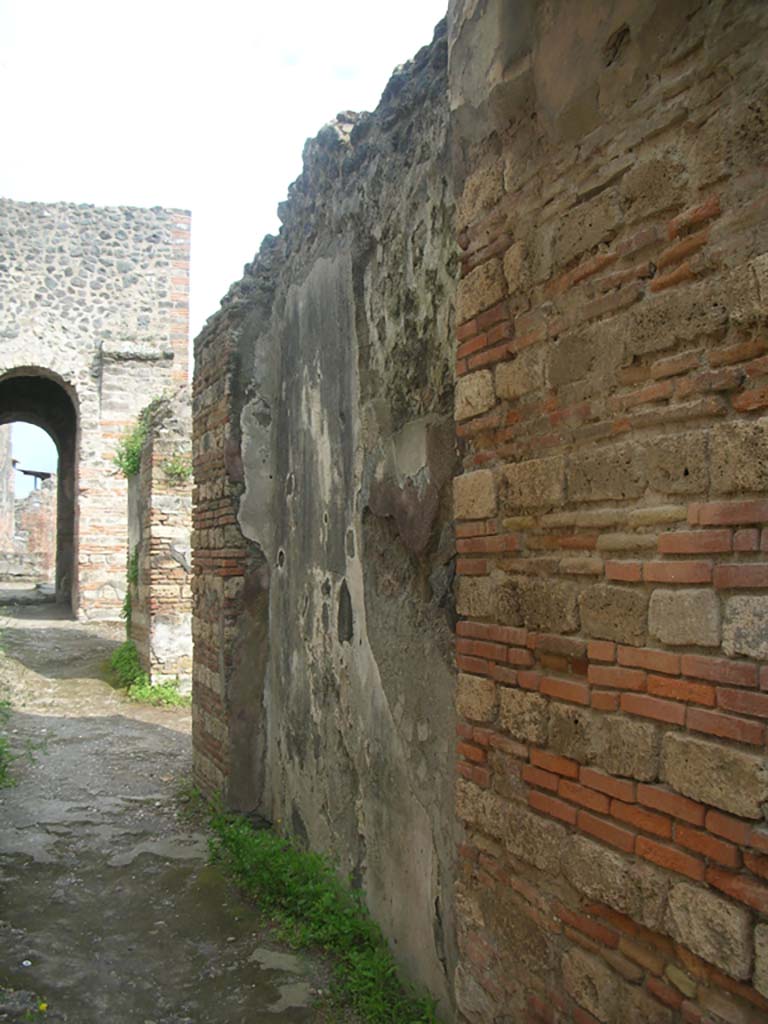 Porta Ercolano or Herculaneum Gate, Pompeii. May 2010. 
Looking south along west wall from north end on east side of gate. Photo courtesy of Ivo van der Graaff.