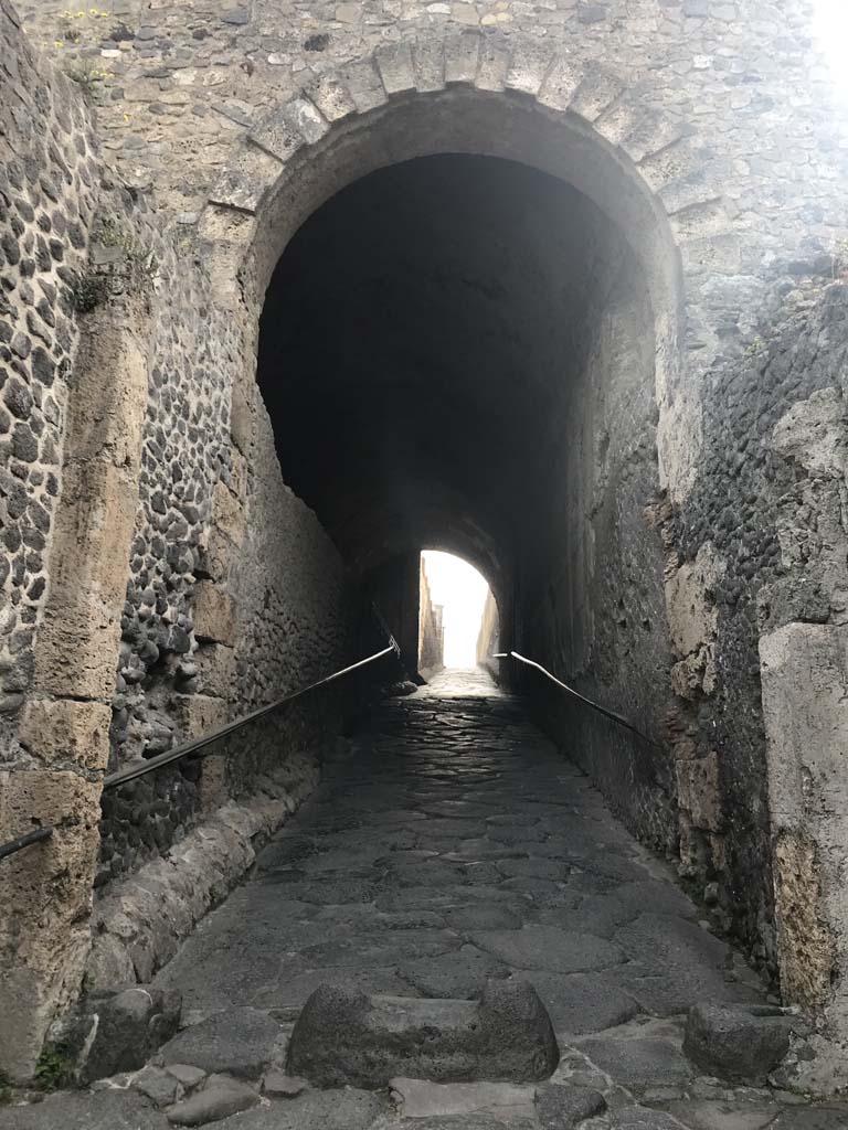 Pompeii Porta Marina. April 2019. Looking east through tunnel under arch, into city. 
Photo courtesy of Rick Bauer.