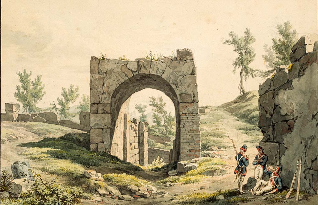 Pompeii Porta Nola. Pre-1824 painting by Jakob Wilhelm Huber “Porta di Nola”. 
The painting shows the Oscan inscription, recording Vibius Popidius overseeing the building, still in situ to the left of the head of Minerva.