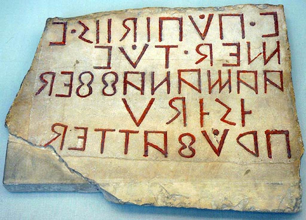 Pompeii Porta Nola. Oscan inscription found on the inner side of the arch of the Nola Gate, near the head of Minerva, readable from right to left.
Now in the British Museum. Inventory number 1867,0508.76.
According to Cooley, this translated as –
Vibius Popidius, son of Vibius, chief magistrate (meddix tuticus) saw to this being built and officially approved it.
See Cooley, A. and M.G.L., 2004. Pompeii: A Sourcebook. London: Routledge. (p.16, A24).