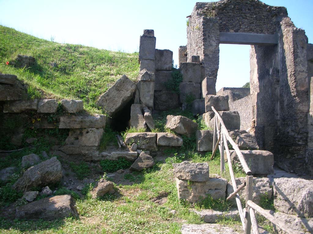 Porta di Nocera or Nuceria Gate, Pompeii. May 2010. 
Looking north on west side of gate, towards site of outlet of drain, centre left. Photo courtesy of Ivo van der Graaff.