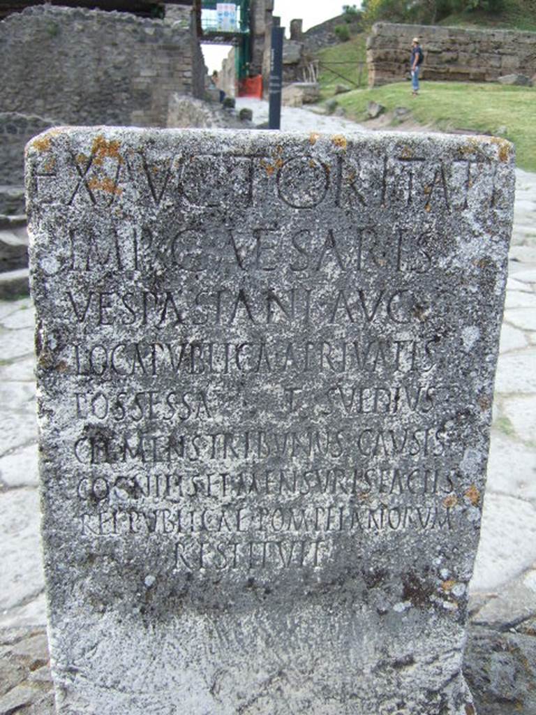 Pompeii Porta Nocera. Cippus of Titus Suedius Clemens. The Cippus is inscribed:
Ex auctoritate 
imp(eratoris) Caesaris 
Vespasiani Aug(usti)
loca publica, a privatis
possessa T(itus) Suedius 
Clemens tribunus causis c
ognitis et mensuris factis 
rei publicae Pompeianorum 
restituit,  
By virtue of authority conferred upon him by the Emperor Vespasian Caesar Augustus, Titus Suedius Clemens, tribune, having investigated the facts and taken measurements, restored to the citizens of Pompeii public places illegally appropriated by private persons. Similar Cippi were found at the Porta Ercolano, Porta Marina and the Porta Vesuvio. The wording “rei publicae Pompeianorum” on one of these, discovered in 1763, was the first positive identification that the site was Pompeii. Until then scholars had divided opinions on the city buried under Civita.  Many, including the first official excavators, thought it was the ancient city of Stabiae. See Conticello, B., Ed, 1990. Rediscovering Pompeii. Rome: L’Erma di Bretschneider. (p. 225).