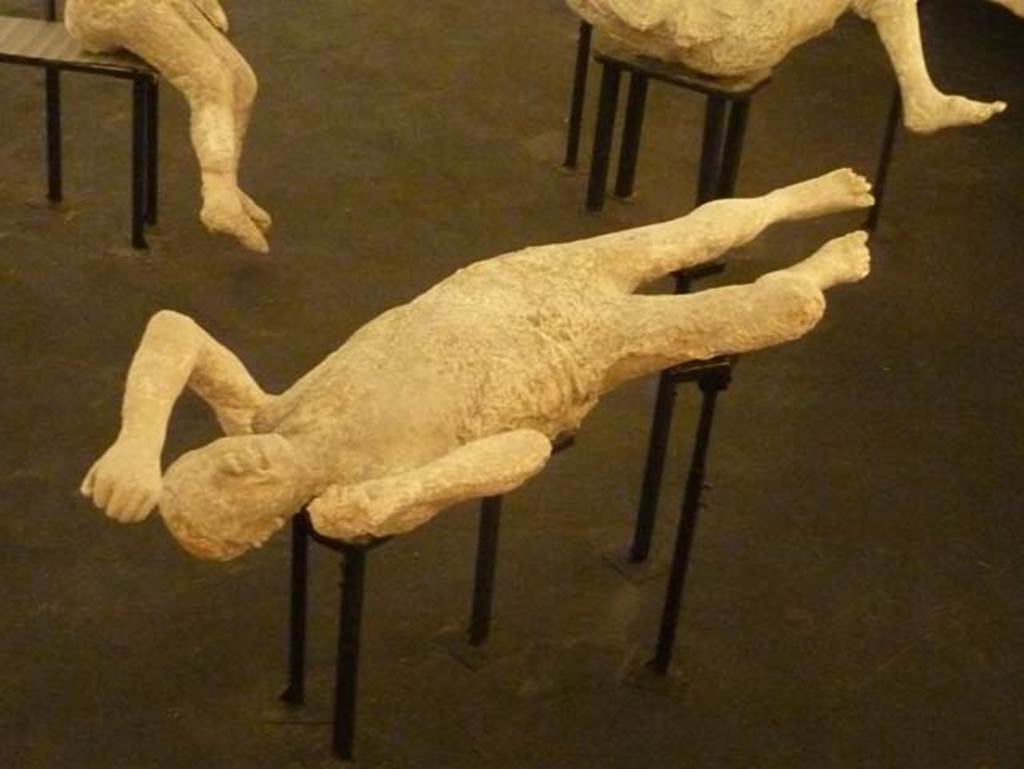 Pompeii Stabian Gate. September 2015. Plaster cast of victim numbered 14 (or 15?), a woman of mature age, see explanation below.  Exhibit from the Summer 2015 exhibition in the amphitheatre.