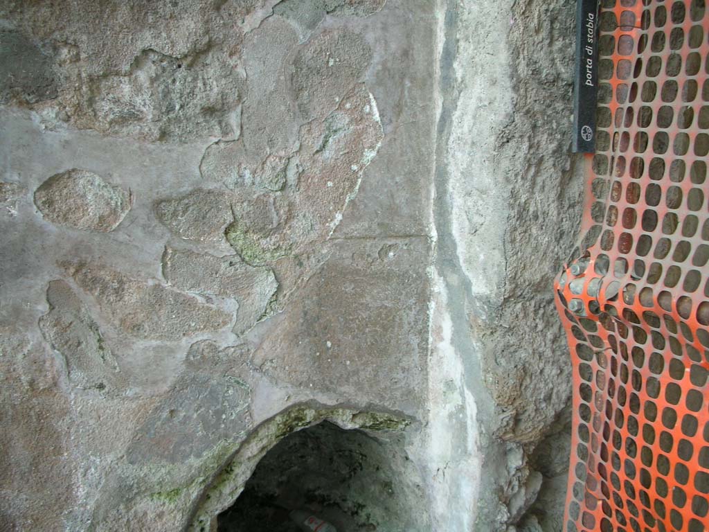 Porta Stabia, Pompeii. May 2010. Plaster remaining on east wall of gate at north end.  Photo courtesy of Ivo van der Graaff.