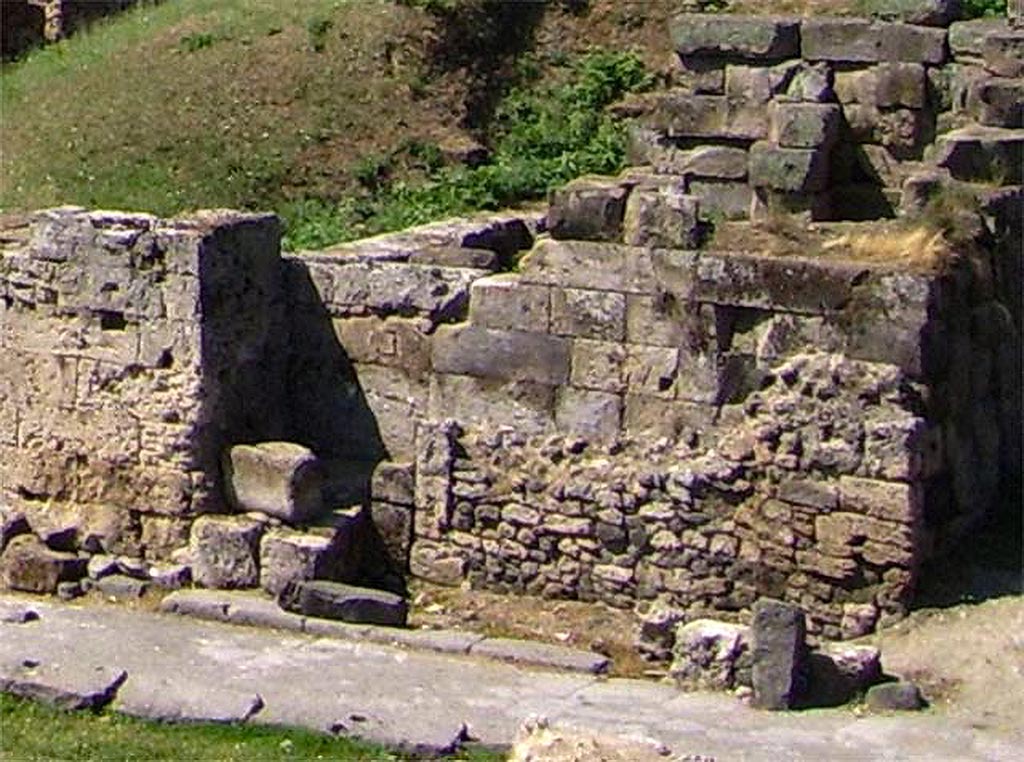 Vesuvian Gate Pompeii. May 2006. 
Behind area C at north-west corner of lower area of gate is a hollow rectangular walled area, above it – the remains of a tower.