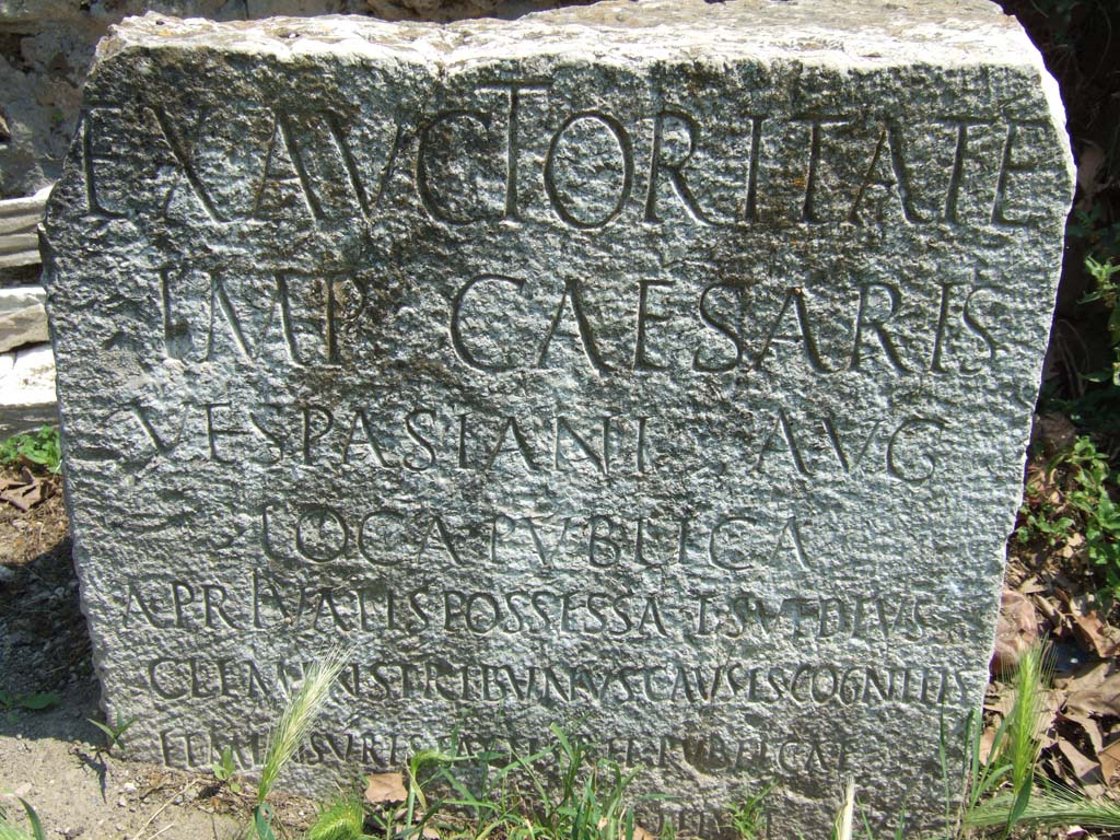 Vesuvian Gate Pompeii. May 2006. VG5 Cippus of Titus Suedius Clemens. The Cippus is inscribed:
Ex auctoritate 
imp(eratoris) Caesaris 
Vespasiani Aug(usti)
loca publica
a privatis possessa T(itus) Suedius 
Clemens tribunus causis cognitis 
et mensuris factis rei publicae
Pompeianorum restituit.
By virtue of authority conferred upon him by the Emperor Vespasian Caesar Augustus, 
Titus Suedius Clemens, tribune, having investigated the facts and taken measurements,
restored to the citizens of Pompeii public places illegally appropriated by private persons.
Similar Cippi were found at the Porta Ercolano, Porta Marina and the Porta Nocera.
The wording “rei publicae Pompeianorum” on one of these, discovered in 1763, was the first positive identification that the site was Pompeii. 
Until then scholars had divided opinions on the city buried under Cività. Many, including the first official excavators, thought it was the ancient city of Stabiae.
See Conticello, B., Ed, 1990. Rediscovering Pompeii. Rome: L’Erma di Bretschneider. (p. 225).