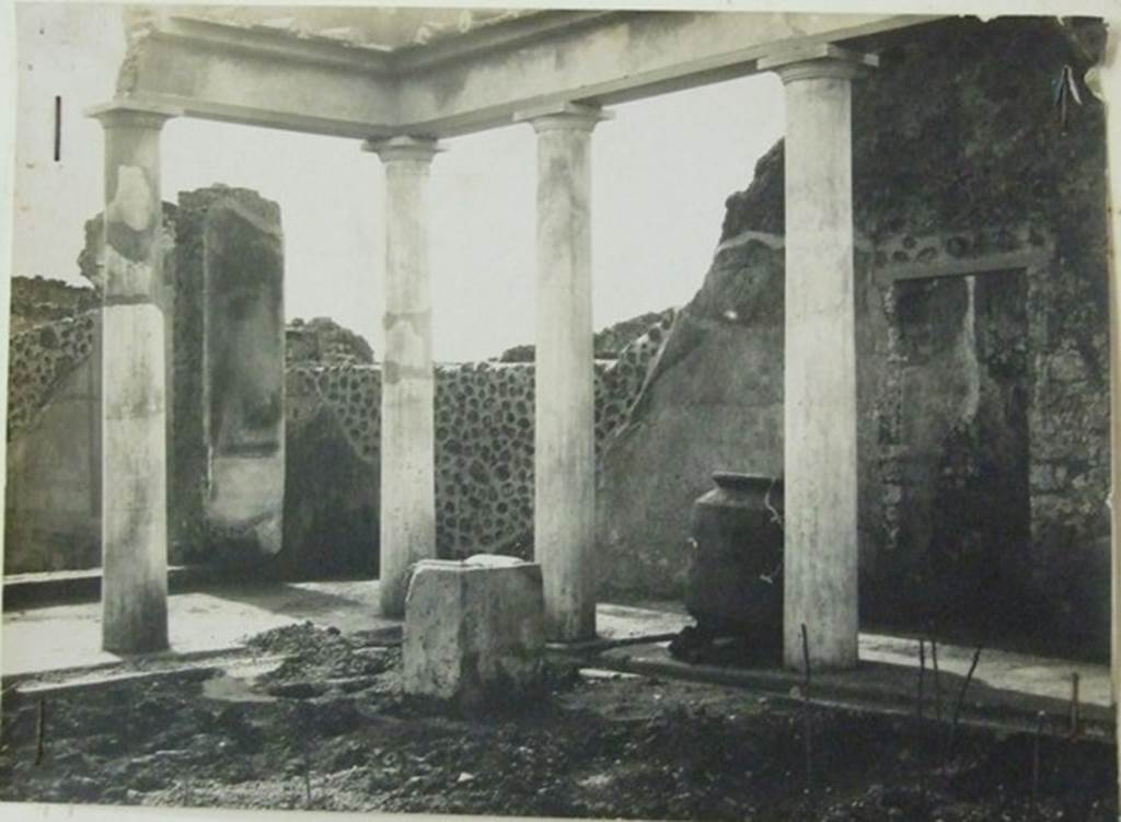 VII.6.28 Pompeii. About 1910. South-west corner of the peristyle.  
In the picture can be seen a low wall or threshold of the tablinum, the andron and the doorway to room 7.  
Also visible is a masonry altar.  This area was devastated by bombing in 1943.
Photograph courtesy of Soprintendenza Speciale per i Beni Archeologici di Napoli e Pompei.  Negative number C369.
 
According to Boyce, near the south-west corner of the peristyle stood a rectangular masonry altar, coated with stucco.
On the top of it, traces of burning were visible at the time of excavation.
He also said that holes found in the earth near the altar were explained by Spano (Not.Scavi) as being the decomposed roots of a large tree.
Spano thought this may have been an arbour sacra, which may have been honoured by sacrifice upon the altar.
See Boyce G. K., 1937. Corpus of the Lararia of Pompeii. Rome: MAAR 14. (p. 67, no. 291)
See Notizie degli Scavi di Antichità, 1910, p. 466f and fig. 9,9a.