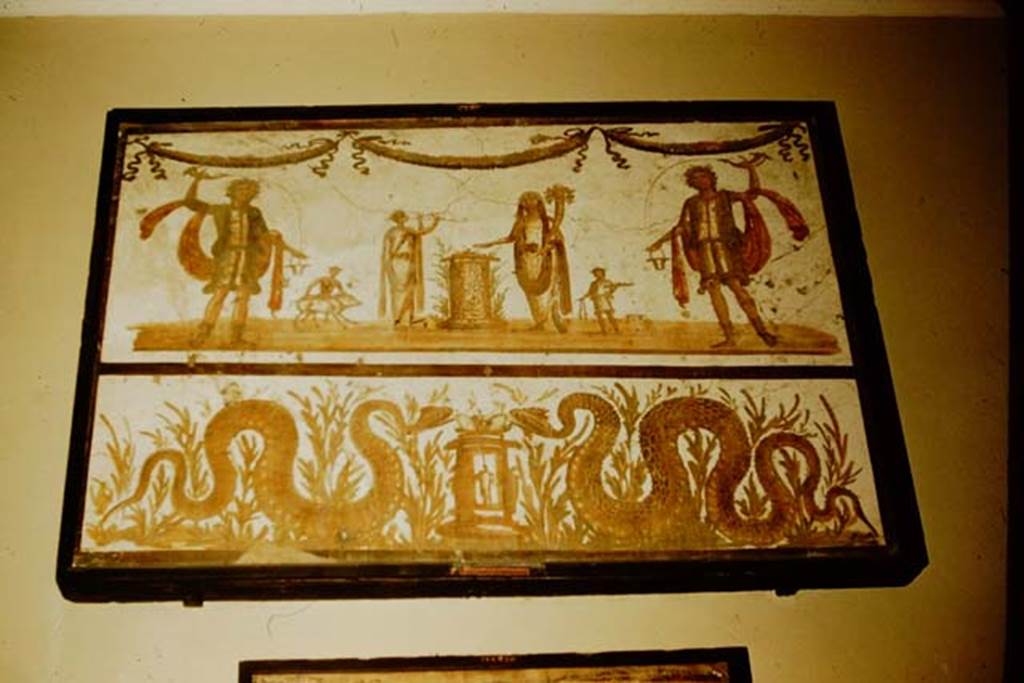 VII.6.38 Pompeii. 1957. Lararium painting from the kitchen. Naples Archaeological Museum inventory number: 8905. Photo by Stanley A. Jashemski.
Source: The Wilhelmina and Stanley A. Jashemski archive in the University of Maryland Library, Special Collections (See collection page) and made available under the Creative Commons Attribution-Non Commercial License v.4. See Licence and use details. J57f0515
