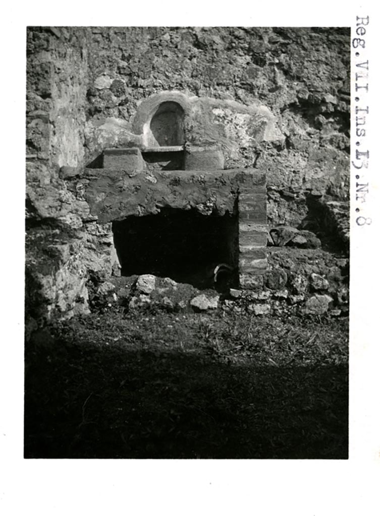 VII.13.7 Pompeii, but shown as VII.13.8 on photo. Pre-1937-39. 
Looking towards niche and hearth against east wall.
Photo courtesy of American Academy in Rome, Photographic Archive. Warsher collection no. 1908.