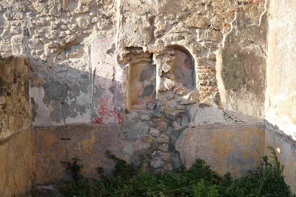 VII.15.5 Pompeii. December 2018. 
Looking towards north wall of small garden with niche and site of cylindrical altar and lararium painting. Photo courtesy of Aude Durand.
