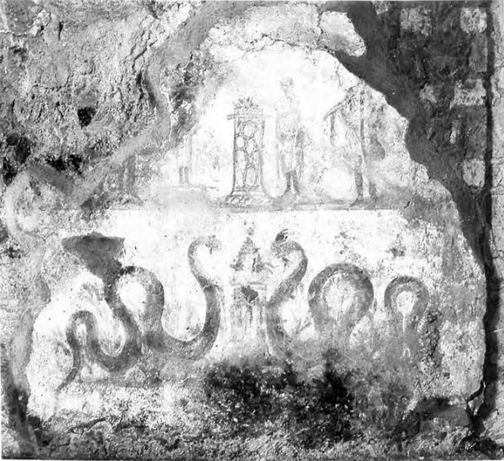 VII.16.22 Pompeii. Lararium painting on south wall of room 28.
In the middle of the upper picture zone on the round altar there is a small, sacrificing genius without a cornucopia and opposite him, on the other side of the altar, is a small Tibicen. Two large Lares flank the scene. Only the lower legs of the left have been preserved. The remains of a garland are visible at the top of the picture. Faint remains of three green plants can be seen between the tibicen and the altar as well as between the genius and the right Lar and at the far-right edge of the picture. In the lower picture zone, two large snakes move from the left and right between green plants towards a round altar in the center of the picture.
See Fröhlich, T., 1991. Lararien und Fassadenbilder in den Vesuvstädten. Mainz: von Zabern. (p.290, L94, Taf. 46,1).