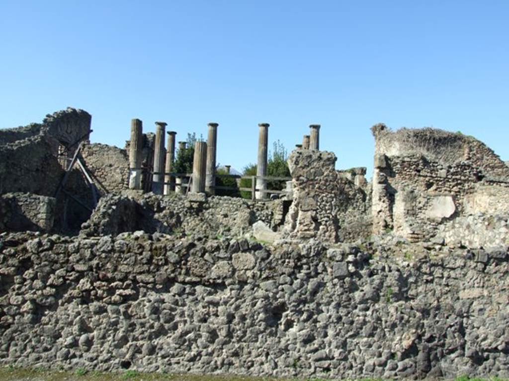 VIII.4.29 Pompeii. March 2009. Looking north from Via del Tempio d’Iside, across remains of peristyle area, behind wall.
According to Boyce, in this peristyle high up on the north wall was an arched niche (h.0.60, w.0.50, d.0.21, h, above floor 1,90).
See Boyce G. K., 1937. Corpus of the Lararia of Pompeii. Rome: MAAR 14. (p.76, no. 363).