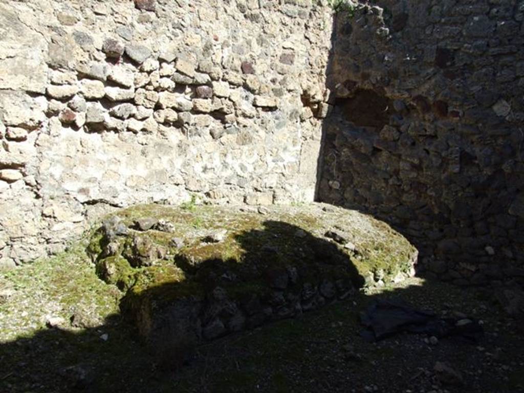 VIII.5.2 Pompeii. March 2009. Room 21, north wall of kitchen with bench or hearth. According to Boyce, in the north wall of the kitchen (?) was an arched niche. Size (height 0.40, width 0.63, depth 0.15, height above the floor 1.35). This does not appear to be visible anymore.
See Boyce G. K., 1937. Corpus of the Lararia of Pompeii. Rome: MAAR 14. (p.366)