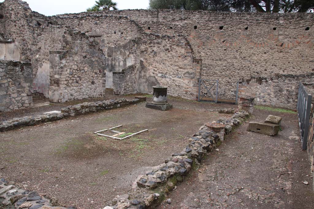 VIII.6.10 Pompeii. October 2020. Looking south-west across peristyle area. Photo courtesy of Klaus Heese.
According to Boyce (who numbers it as VIII.7.9) –
In the peristyle against the wall to the right of the entrance doorway from the street, stands a projecting base (h.1.15, w.1.40, d.0.30).
Traces of original covering with slabs of marble are still to be seen and above it are the remains of a vanished lararium painting.
The top of the pilaster was apparently meant to serve as altar for offerings. 
Nearby was found a small cylindrical altar of tufa (diam.0.28, h.0.32), which Mau supposes was used instead of the top of the pilaster in the last days of the city.
See Bull. Inst. 1884, 183.
See Boyce G. K., 1937. Corpus of the Lararia of Pompeii. Rome: MAAR 14. (p.78, no. 375).