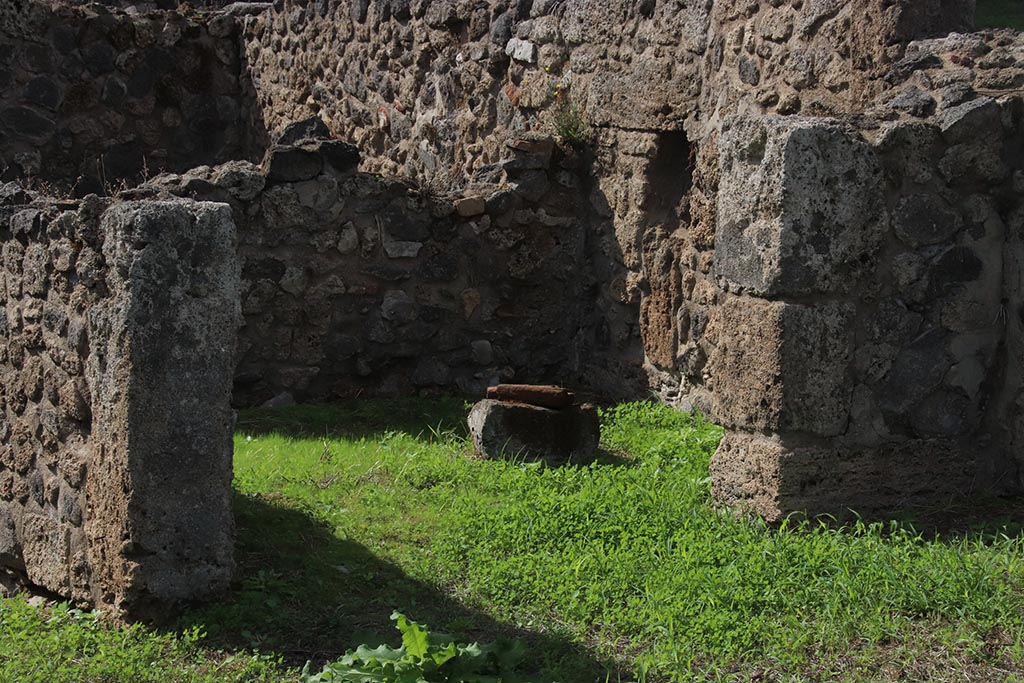 VIII.7.10 Pompeii. October 2024. 
Looking towards rear room of shop-room, with a niche/recess in the north wall? Photo courtesy of Klaus Heese.