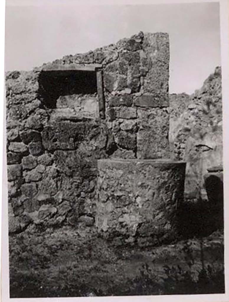 IX.1.3/33 Pompeii. Pre-1943. 
Looking west from oven towards one of the tubs with niche above, the one on south side of doorway, no longer there. 
Photo by Tatiana Warscher.
See Warscher, T. Codex Topographicus Pompeianus, IX.1. (1943), Swedish Institute, Rome. (no.10), p. 22.