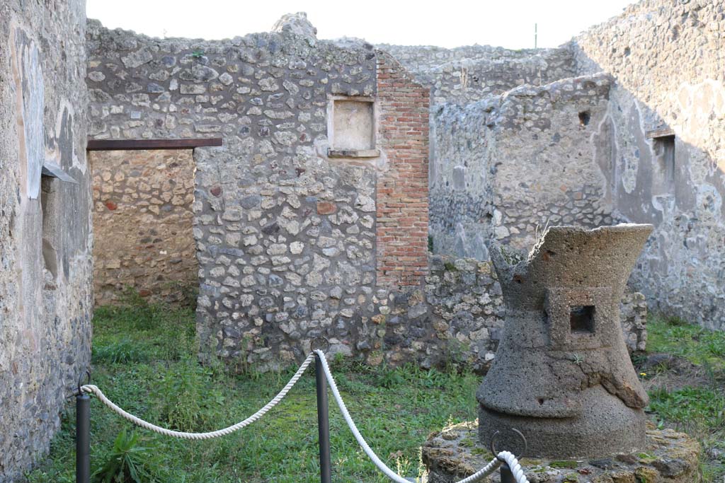 IX.3.20 Pompeii. December 2018. 
Room 1, looking west towards doorway to room 9 and niche on west wall. Photo courtesy of Aude Durand.