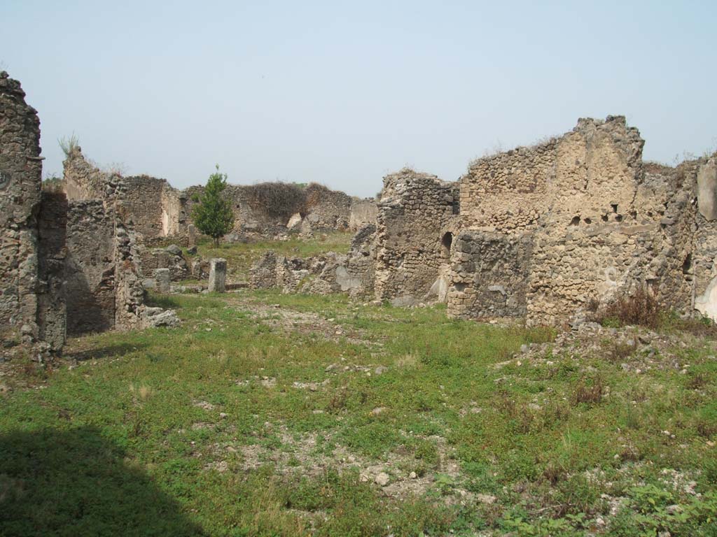 IX.6.g Pompeii. May 2005. North-west corner of peristyle, looking towards remains of IX.6.4. 
The room in the north-west corner of the peristyle would have been approximately on the right of the above photo.