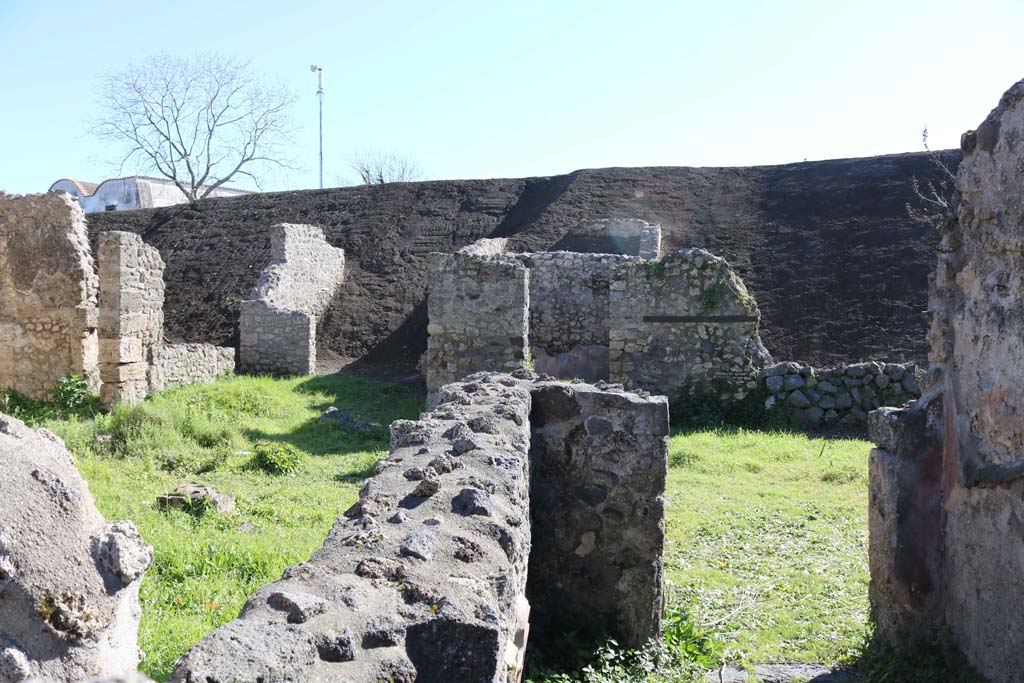 IX.8.c Pompeii. February 2020. 
Looking from rooms on north side across peristyle towards a room on south side, and into the unexcavated. Photo courtesy of Aude Durand.