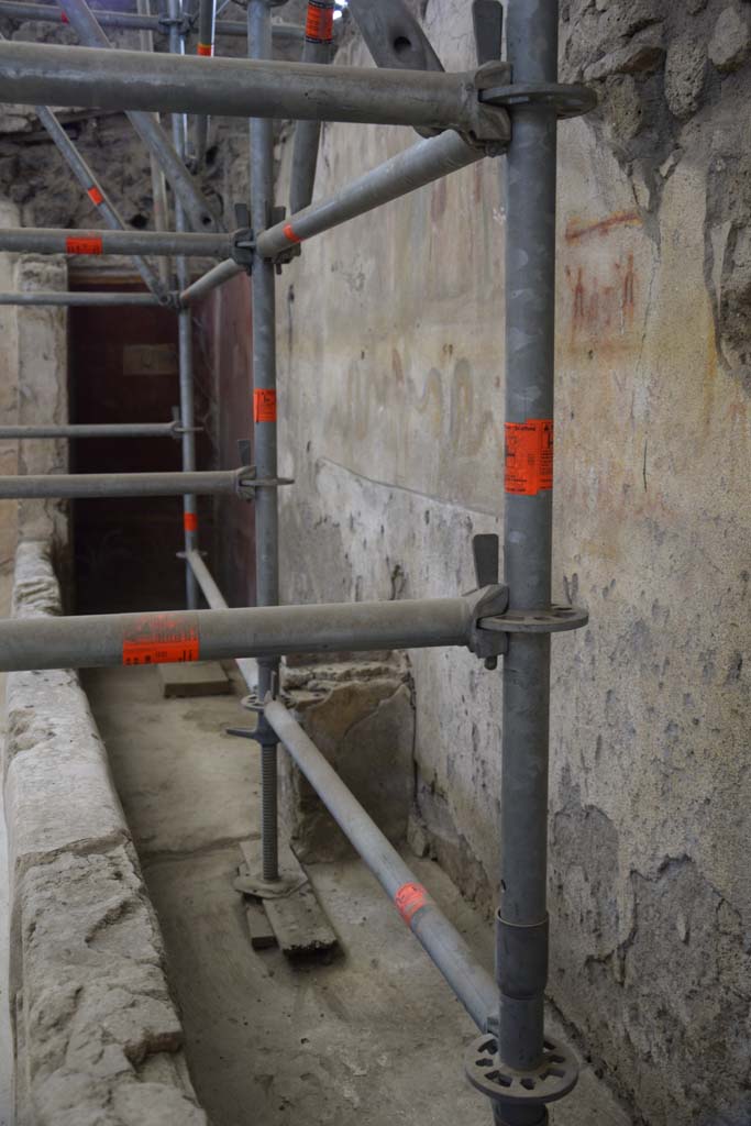 IX.12.6 Pompeii. February 2017. 
Room "n1", looking south along west wall towards lararium with altar below. Photo courtesy of Johannes Eber.