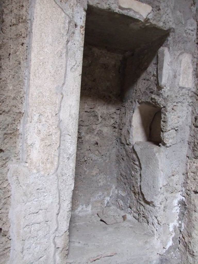 IX.13.1-3 Pompeii. March 2009. Room 2, north-east corner of atrium. 
Recess with 1 niche above, and 1 niche in east side.