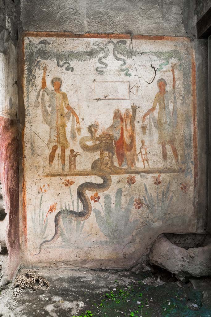IX.13.1-3 Pompeii. October 2021. 
Room 21, lararium in south-west corner, west wall of services atrium. Photo courtesy of Johannes Eber.