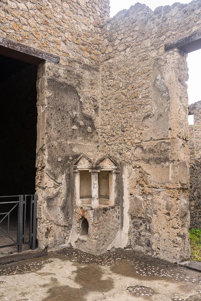 IX.14.4 Pompeii. July 2024.
North-west corner of atrium with lararium shrine 32. Photo courtesy of Johannes Eber.