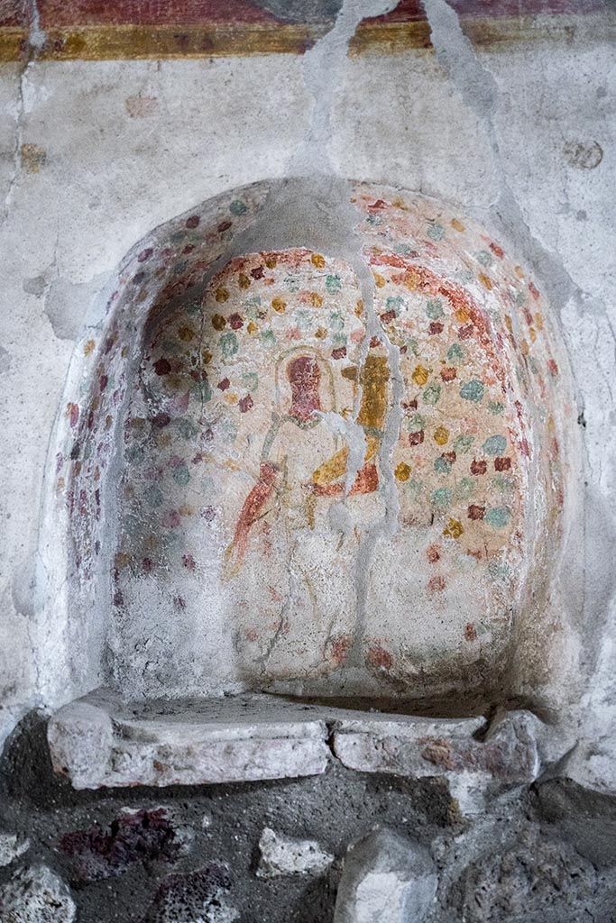 IX.14.4 Pompeii. July 2024. 
Detail of painted niche of lararium set into south wall of kitchen. Photo courtesy of Johannes Eber.