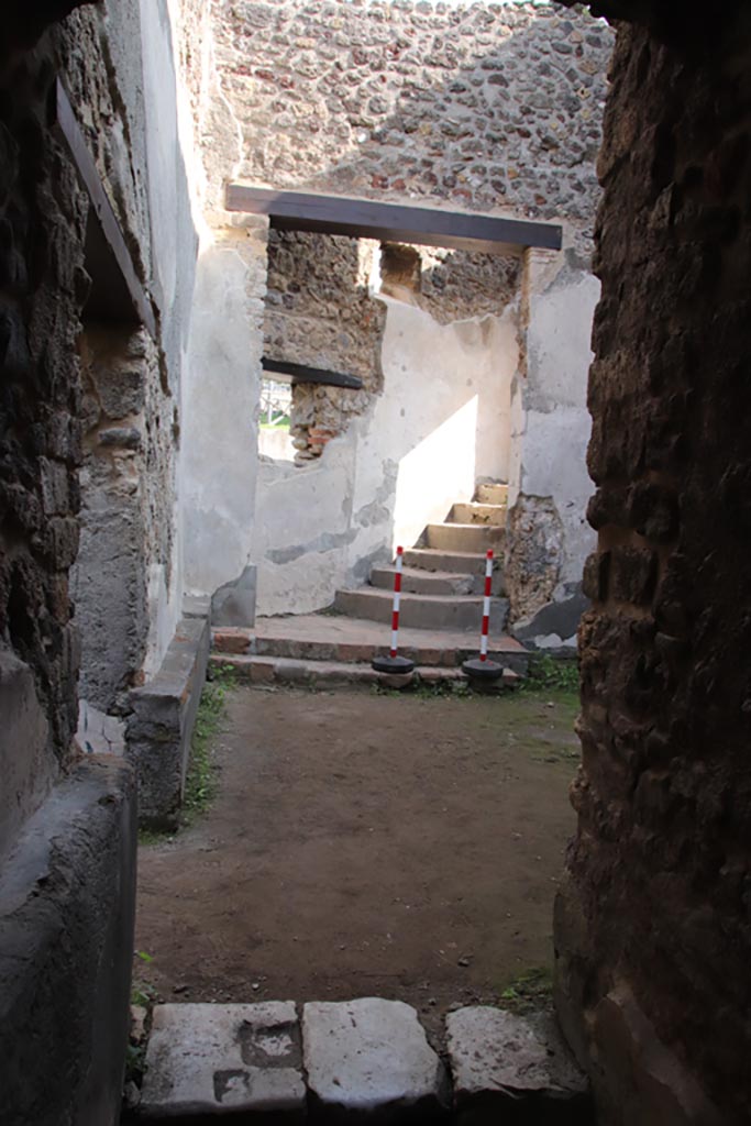 Villa of Diomedes, Pompeii. October 2023. 
Room 5,18, looking east towards steps up to peristyle, from end of corridor 5,12.
Photo courtesy of Klaus Heese.