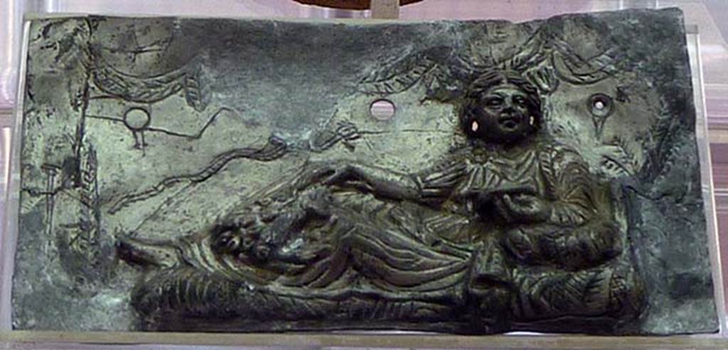 Boscoreale, Villa rustica in via Casone Grotta, proprietà Risi di Prisco. Lararium. Restored silver plaque with relief of a female figure relaxing.
Now in Boscoreale Antiquarium. Photo courtesy of Michael Binns.