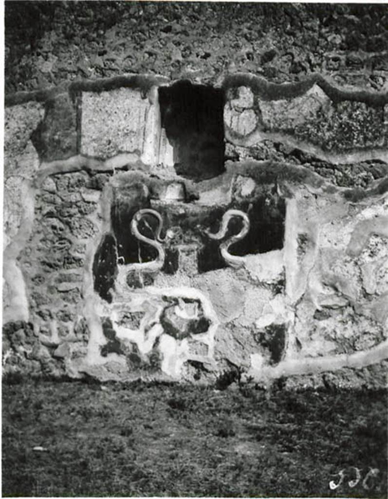 I.2.3 Pompeii. 1912 photo by Tatiana Warscher.
Lararium in the south wall of the atrium.
Warscher noted that the photo was taken by her in 1912 (on her honeymoon!).
When writing the DAIR copy of the Codex (1935) she wrote –
“Adesso i serpenti sono in uno stato peggiore. Il Genio familiare con patera e cornucopia non esisteva già nell’anno 1912”.
(translation: “Now the serpents are in a bad state. The Genius with plate and cornucopia did not exist even by 1912”.)
See Warscher T., 1935. Codex Topographicus Pompeianus: Regio I.2. (no.3), Rome: DAIR, whose copyright it remains.