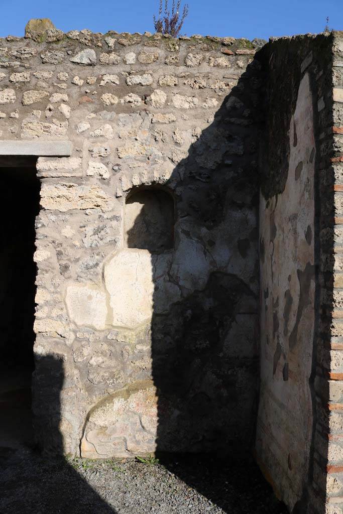I.7.11 Pompeii. December 2018. 
Remains of lararium on east side of atrium belonging to original house I.7.10.
Photo courtesy of Aude Durand.