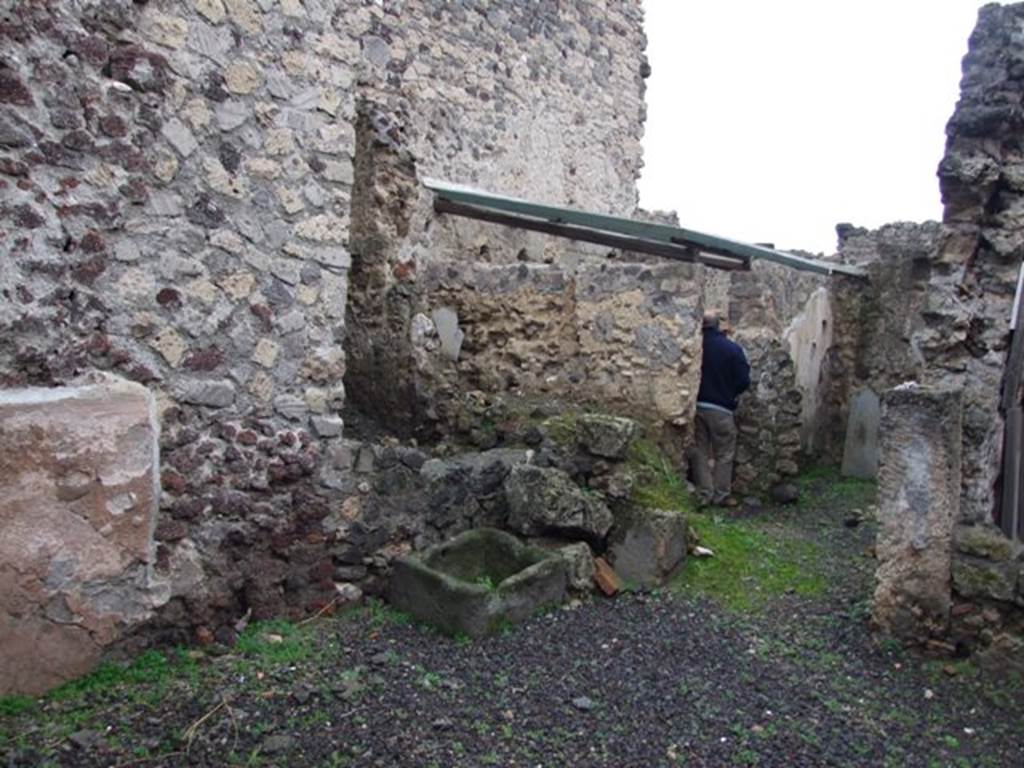 I.8.14 Pompeii. December 2007. 
Courtyard 7, looking across garden area towards north-east corner, and doorway into room 8, on right.
From room (8), you enter the kitchen to the north-west, with an adjoining latrine (10) and (11), and to the east into room 9, the only one that preserves more substantial remains of pictorial decoration of the IVth Style.