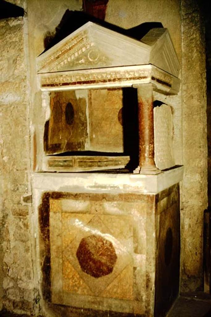 I.10.4 Pompeii. 1957.  Lararium in atrium. Photo by Stanley A. Jashemski.
Source: The Wilhelmina and Stanley A. Jashemski archive in the University of Maryland Library, Special Collections (See collection page) and made available under the Creative Commons Attribution-Non Commercial License v.4. See Licence and use details.
J57f0489