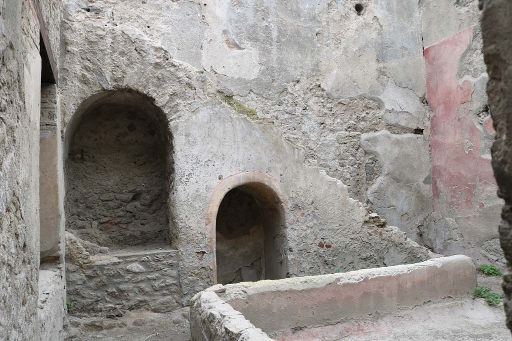 I.12.5 Pompeii. December 2018. 
Looking east across garden area towards two masonry alcoves built under the stairs against the east wall.
Photo courtesy of Aude Durand.