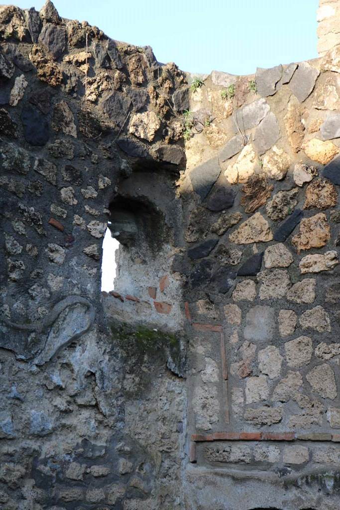 I.12.12 Pompeii. December 2018. 
Detail of window or second niche in north-west corner of west wall. Photo courtesy of Aude Durand.