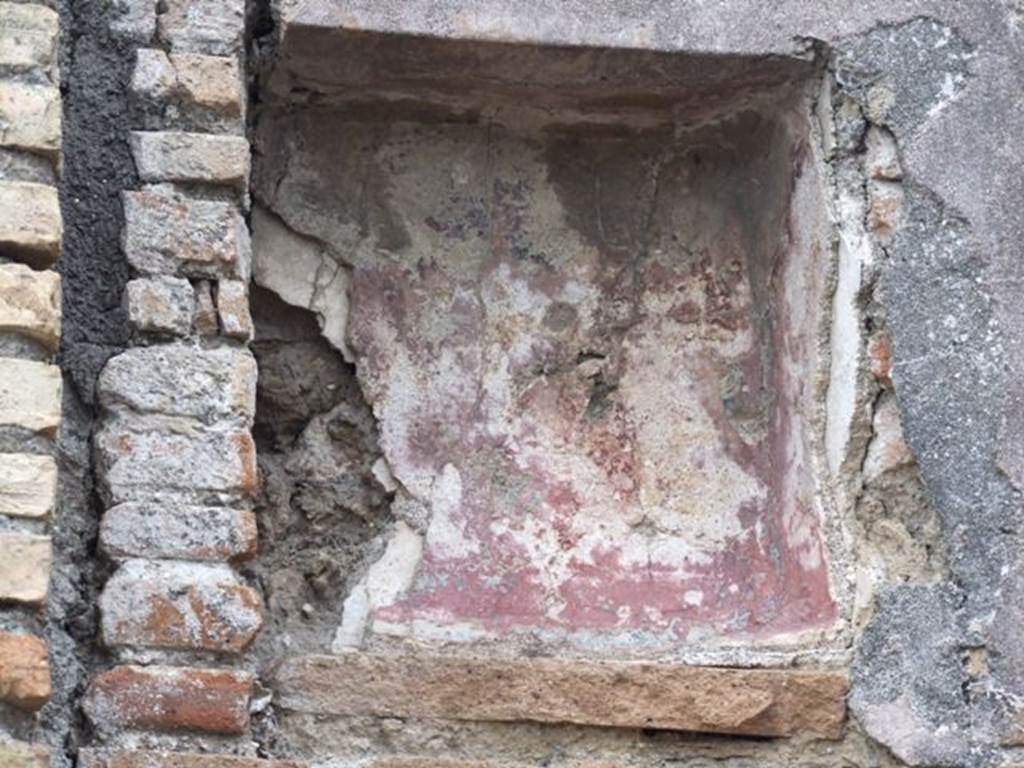 V.1.30 Pompeii. December 2007. Niche on north wall.  According to Boyce, the back wall of the niche was last painted red with a blue border. Underneath this last coat of plaster, several earlier ones could be seen by him. See Boyce G. K., 1937. Corpus of the Lararia of Pompeii. Rome: MAAR 14. (82, p .33)