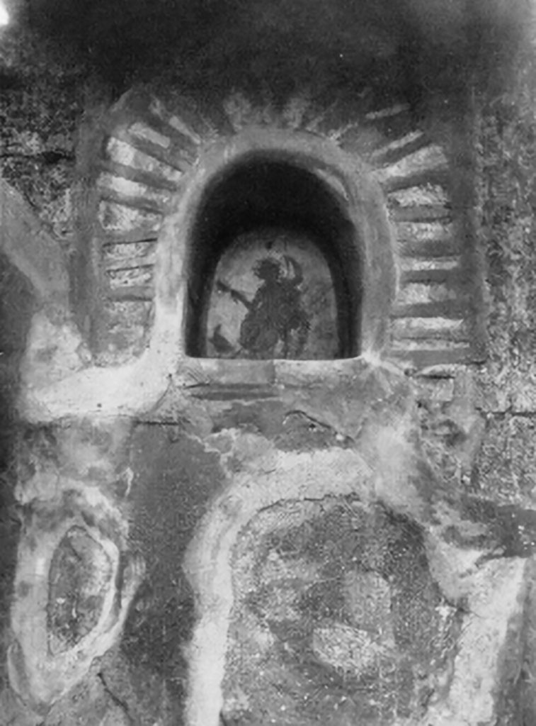 V.2.4 Pompeii. Atrium south wall. Niche with Jupiter seated upon a throne.
Photo by Tatania Warscher.
See Boyce G. K., 1937. Corpus of the Lararia of Pompeii. Rome: MAAR 14, (p.34, n. 86, Pl.2,6).