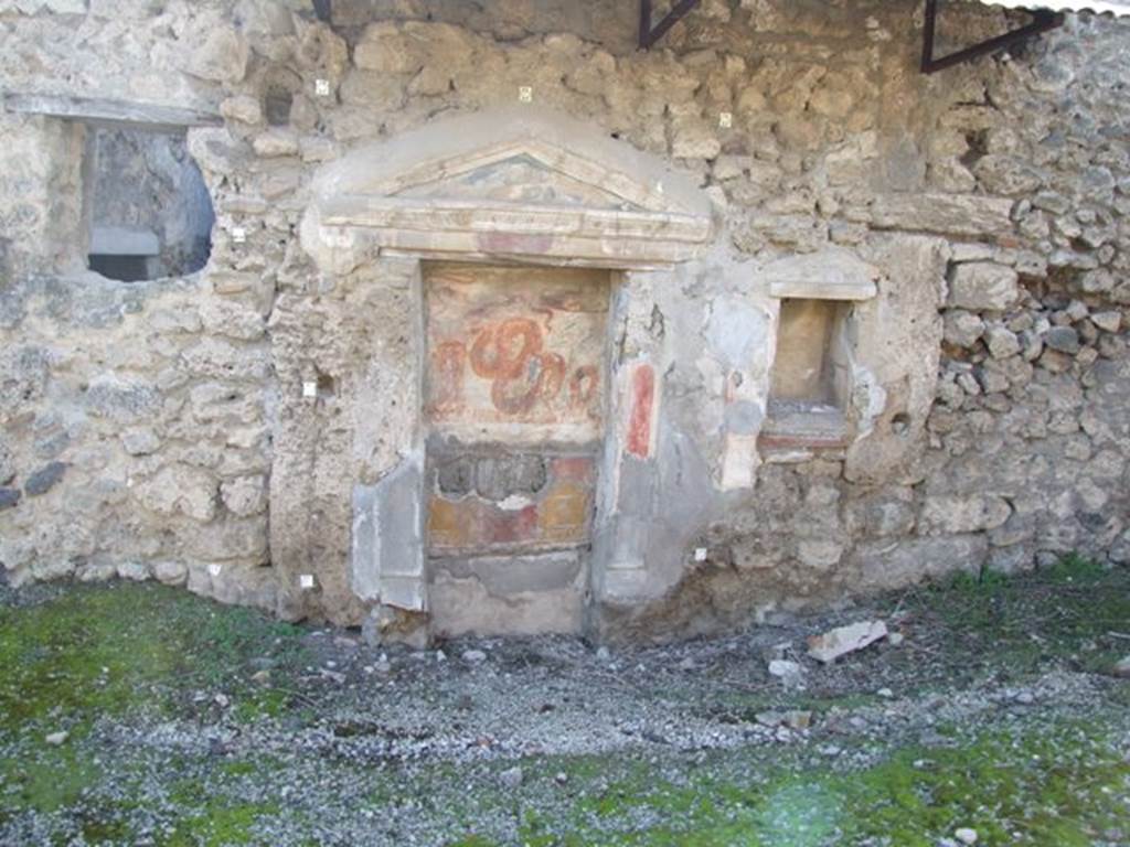 V.3.7 Pompeii. March 2009. West wall of the garden area. Aedicula lararium, with second niche.
Giacobello describes this as a pseudo-aedicula lararium.
See Giacobello, F., 2008. Larari Pompeiani: Iconografia e culto dei Lari in ambito domestico. Milano: LED Edizioni, (p.266 no.V37)