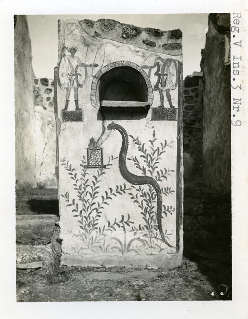V.3.9 Pompeii. pre-1937-39. Lararium on north side of atrium, with 2 Lares dressed in short tunics.
Photo courtesy of American Academy in Rome, Photographic Archive. Warsher collection no. 551
Under the niche can be seen the serpent. A small marble altar was found inside the niche.
See Giacobello, F., 2008. Larari Pompeiani: Iconografia e culto dei Lari in ambito domestico. Milano: LED Edizioni. (p.239)