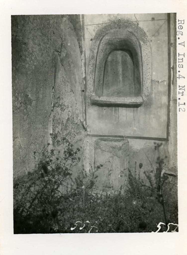 V.4.13 Pompeii but shown as V.4.12 on photo. Pre-1937. 
Looking towards lararium niche in north-west corner of garden area, and masonry altar.
Photo courtesy of American Academy in Rome, Photographic Archive. Warsher collection no. 557.