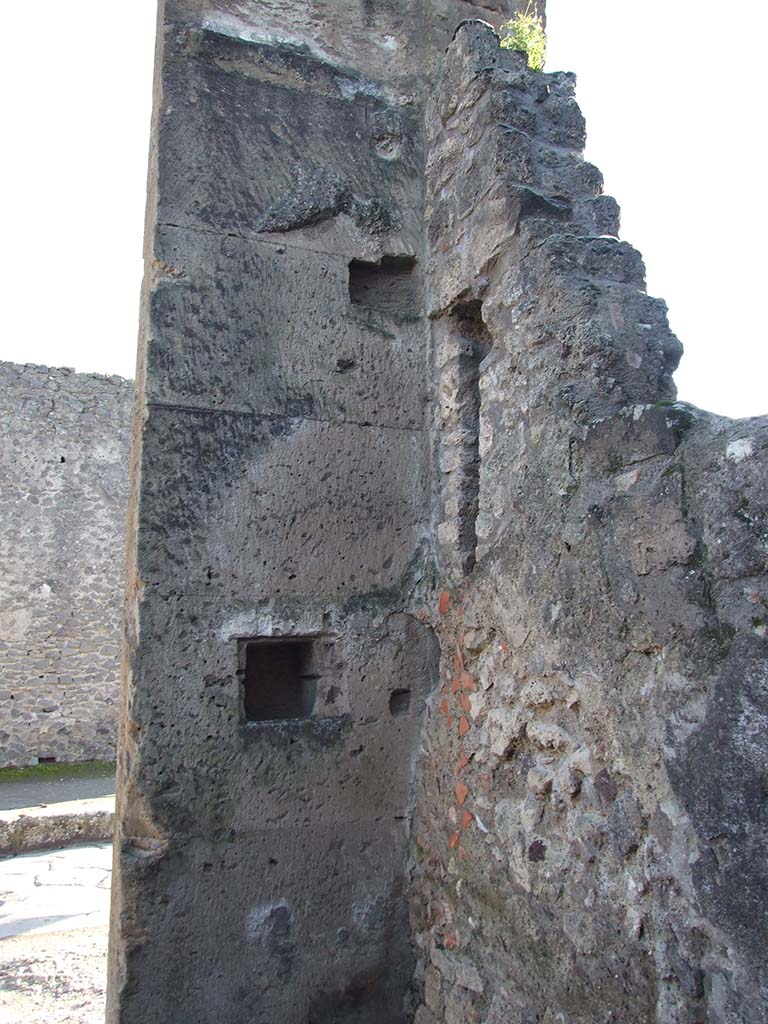 VI.12.4 Pompeii. December 2006. South-west corner of shop, on left side of doorway.
According to Boyce –
in the south wall to the left of the entrance, is a rectangular niche (h.0.27, w.0.25, d.0.20, h. above floor 1.35).
See Boyce G. K., 1937. Corpus of the Lararia of Pompeii. Rome: MAAR 14. (p.52, no.191)